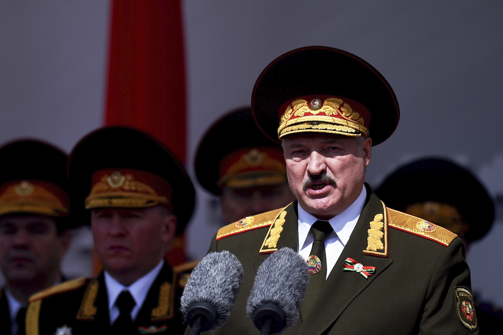 FILE In this file photo taken on Saturday, May 9, 2020, Lukashenko refused to impose any restrictions, making Belarus the only country in Europe to continue playing professional soccer games with fans in the stands while the outbreak was in full swing. Religious service and other mass gatherings went on unimpeded, and the nation had a massive military parade in May to mark the 75th anniversary of the Nazi defeat in World War II. (Sergei Gapon/Pool via AP, File) ArcInfo